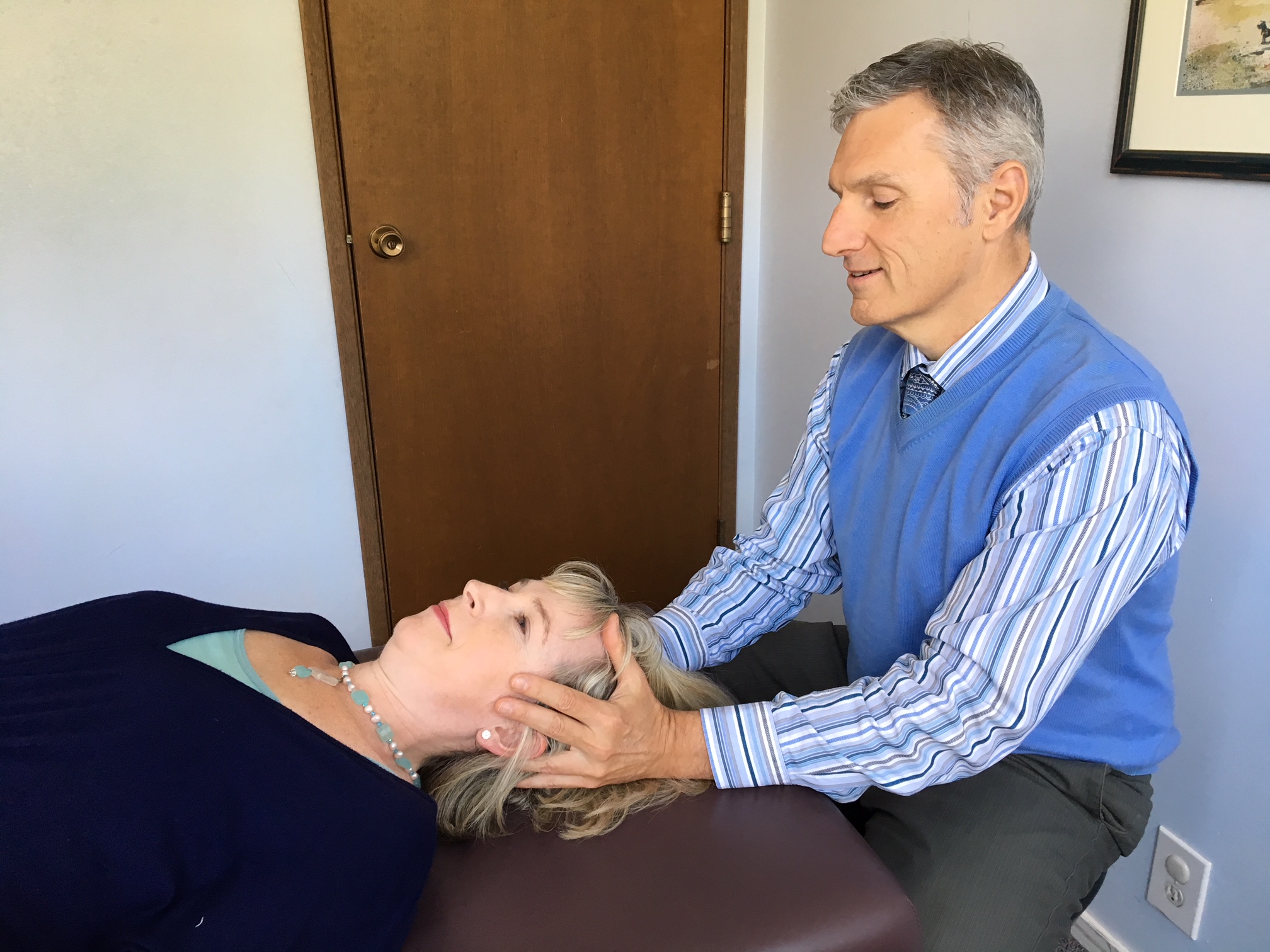 image of Dr. Robertson performing treatment on a woman