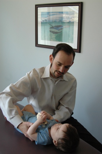 image of Dr. Cavenaugh performing treatment on a baby