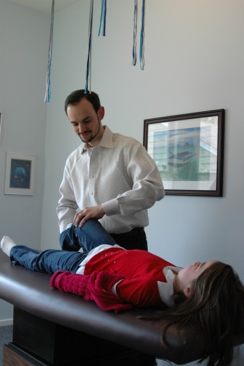 image of Dr. Cavenaugh performing treatment on a young girl